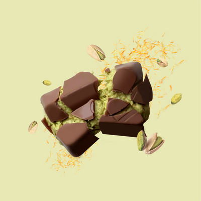 Milk chocolate bites broken open to show pistachio and crunchy kunafa filling