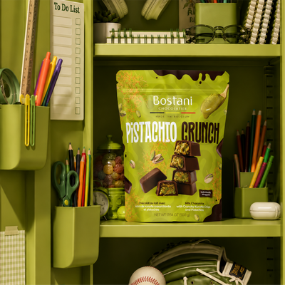 Bag of Bostani Pistachio Crunch chocolate on a green shelf