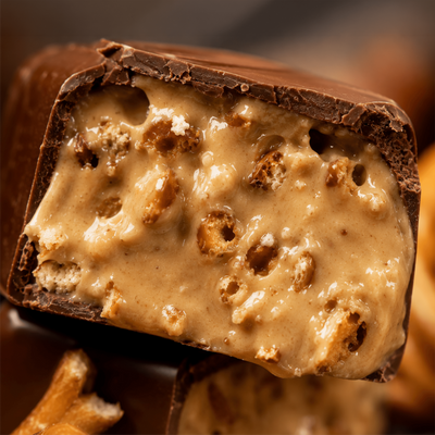 Close-up of the crunchy pretzel cream filling inside a chocolate bite